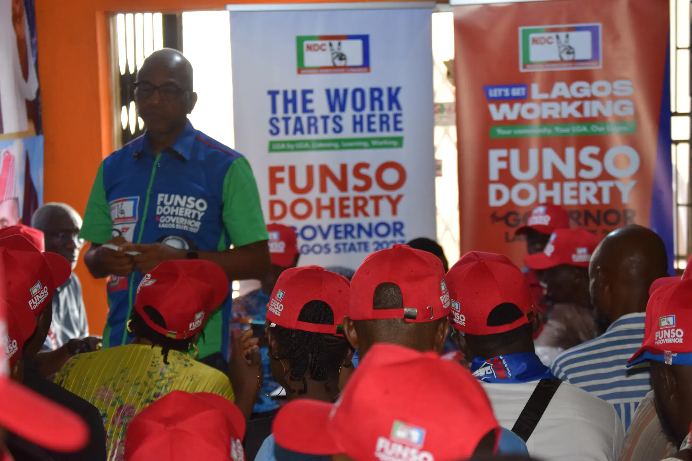 Funso Doherty with people during his visit to Alimosho.
