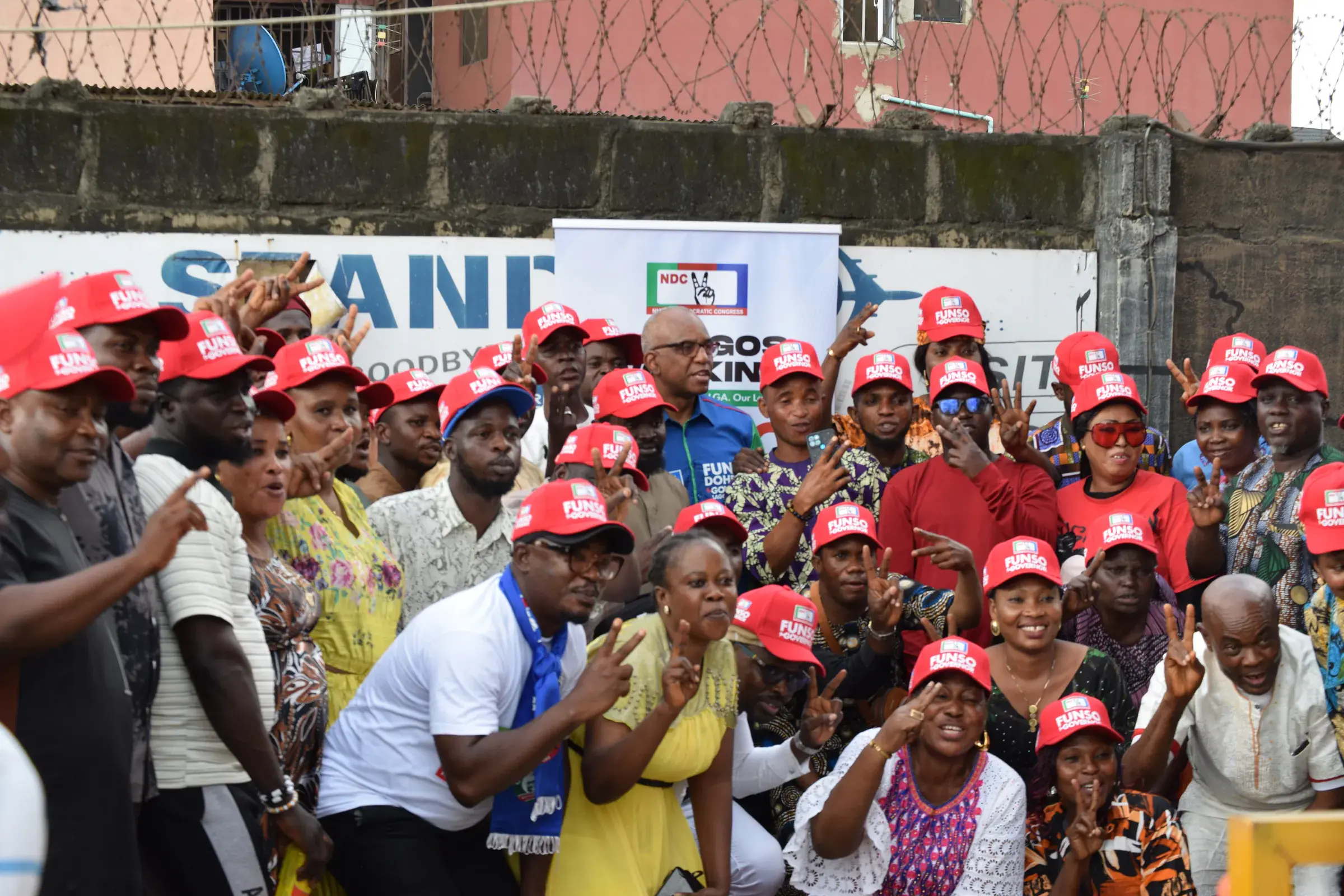 Funso Doherty with people during his visit to Alimosho.