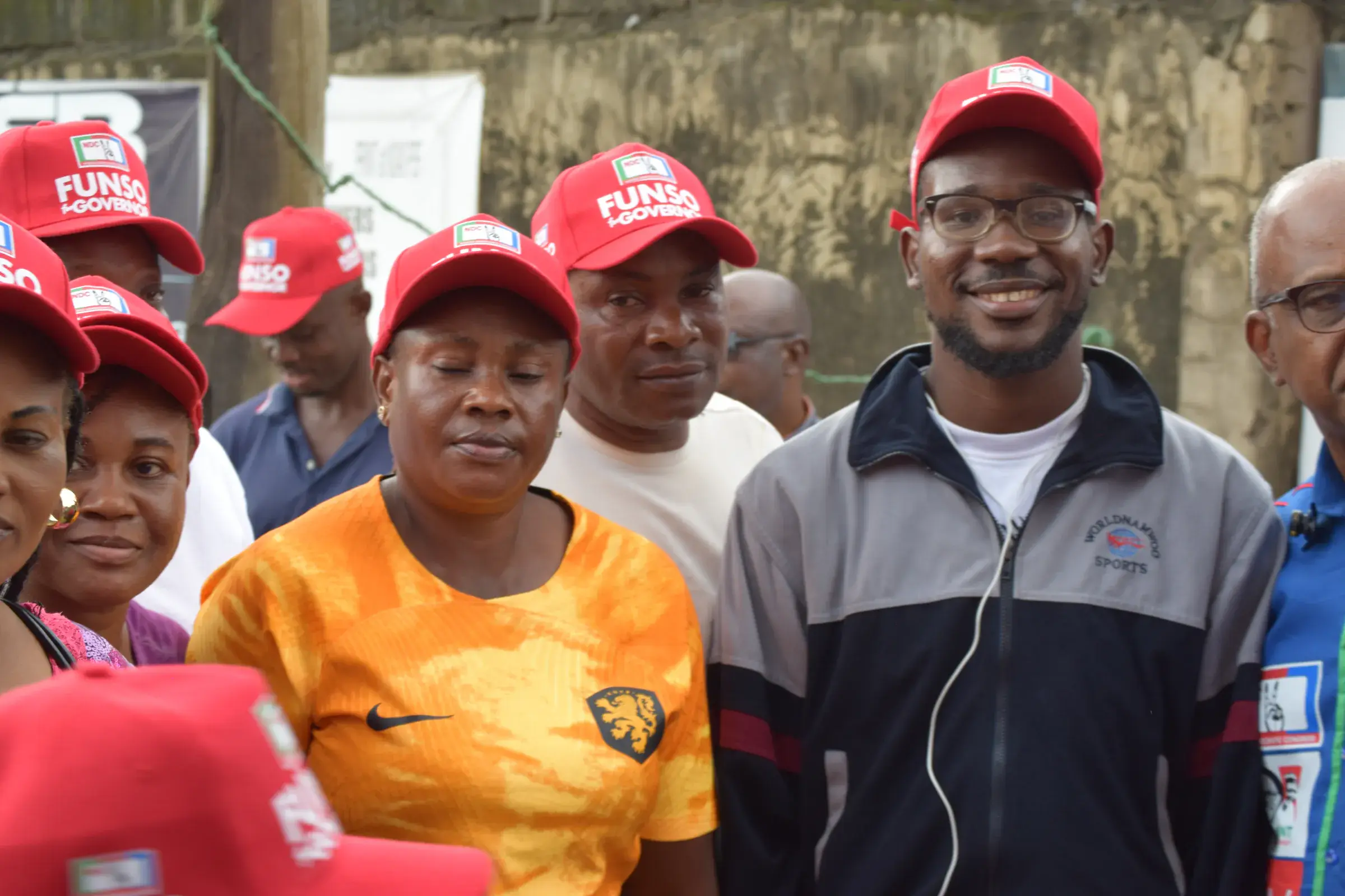 Funso Doherty with people during his visit to Alimosho.