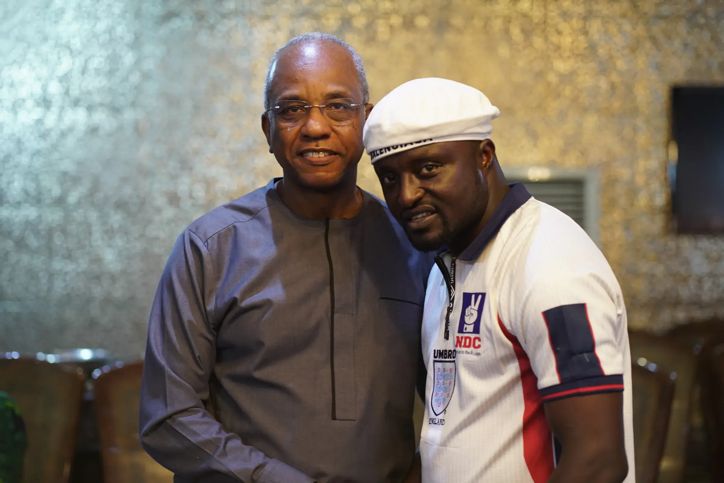 Funso Doherty with people at an NDC Lagos State executive meeting.