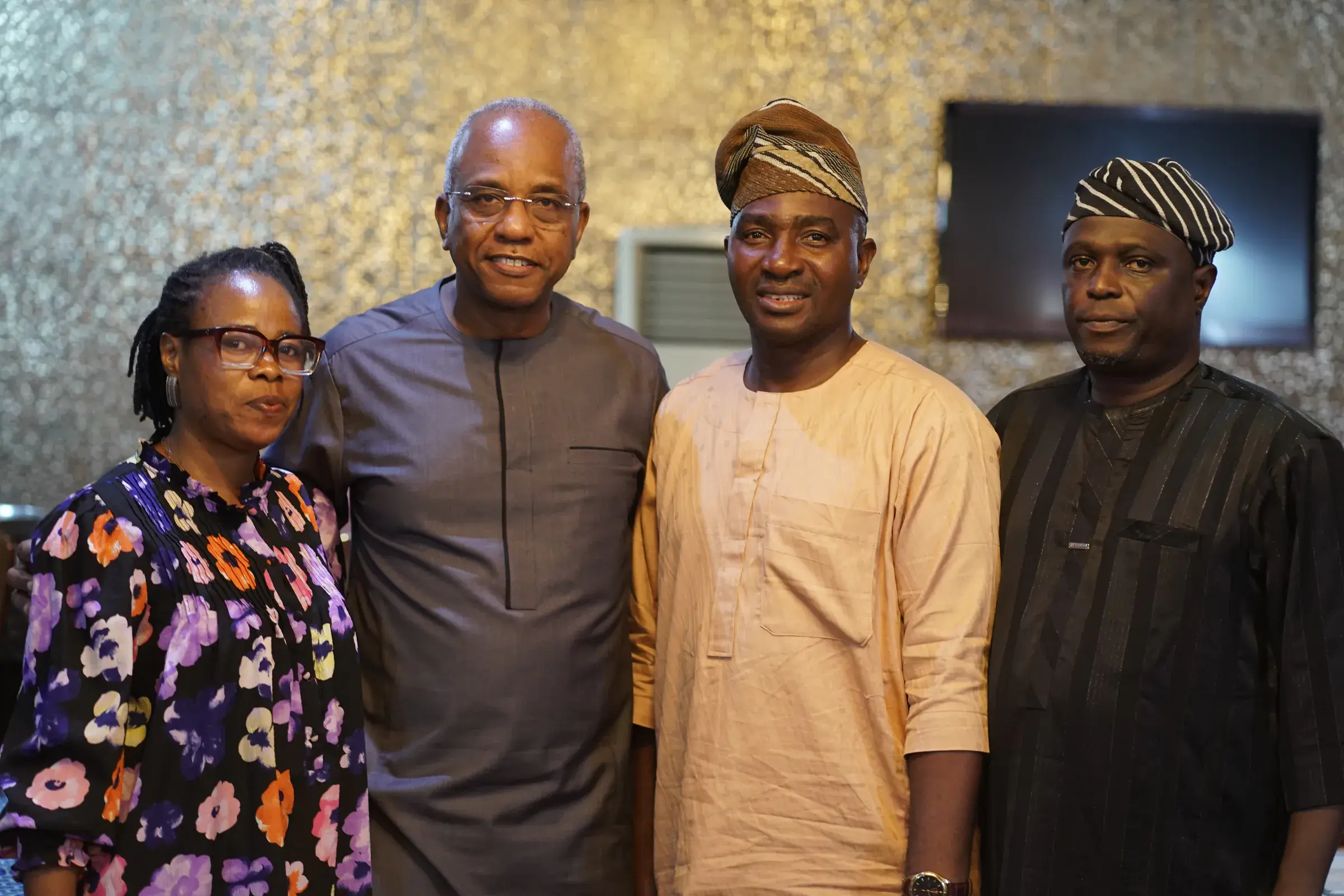 Funso Doherty with people at an NDC Lagos State executive meeting.